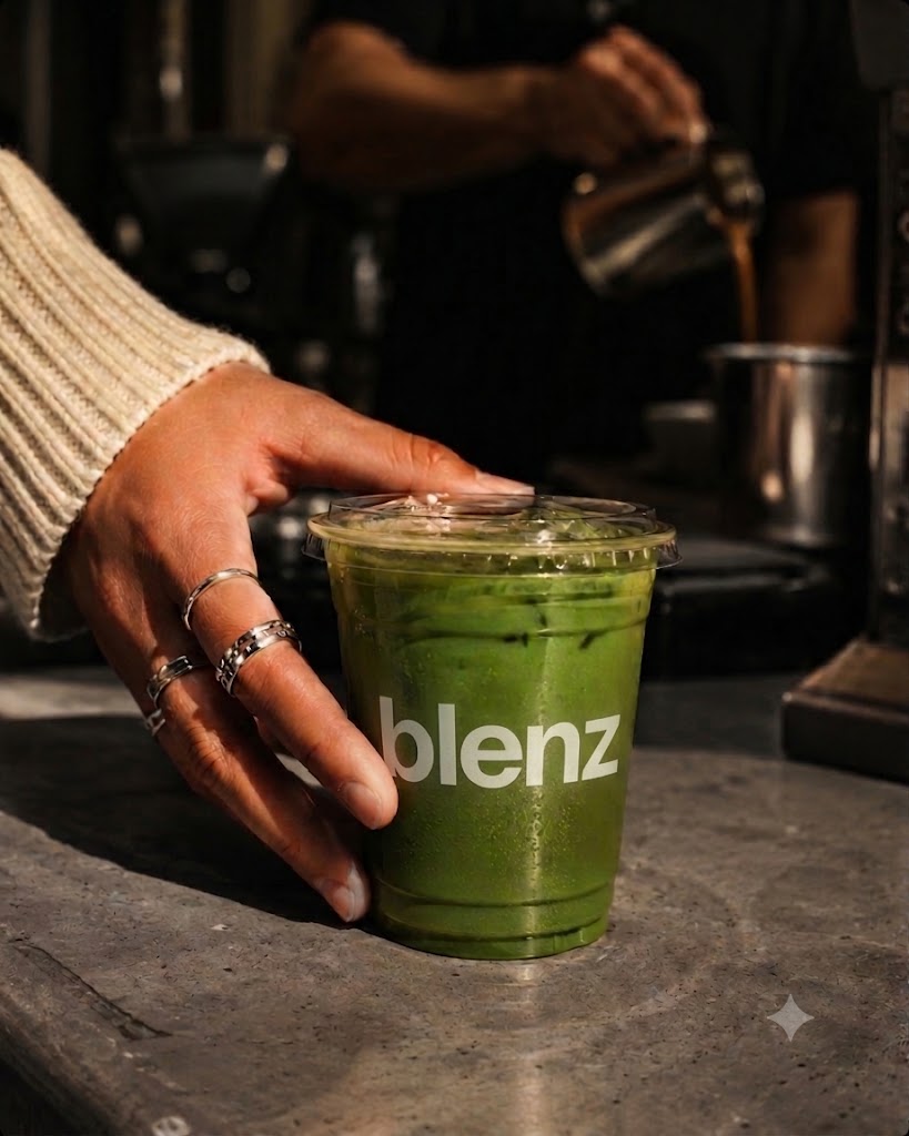 Matcha iced latte hand reaching