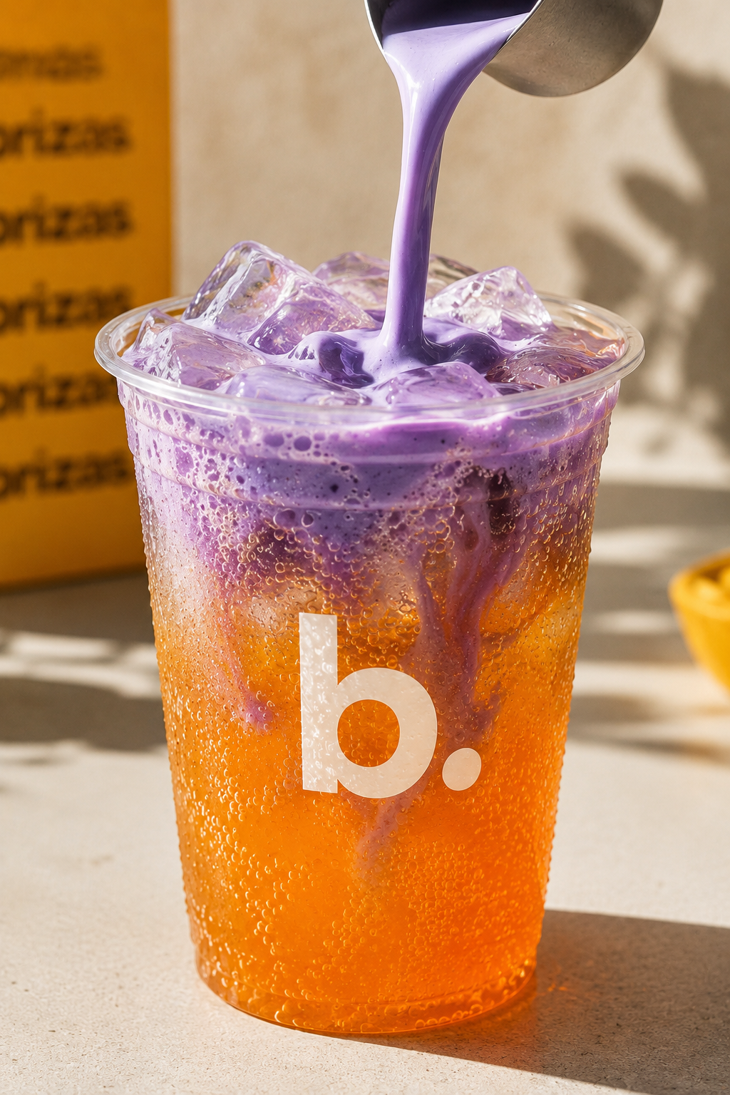 Orange syrup pouring into a blenz briza